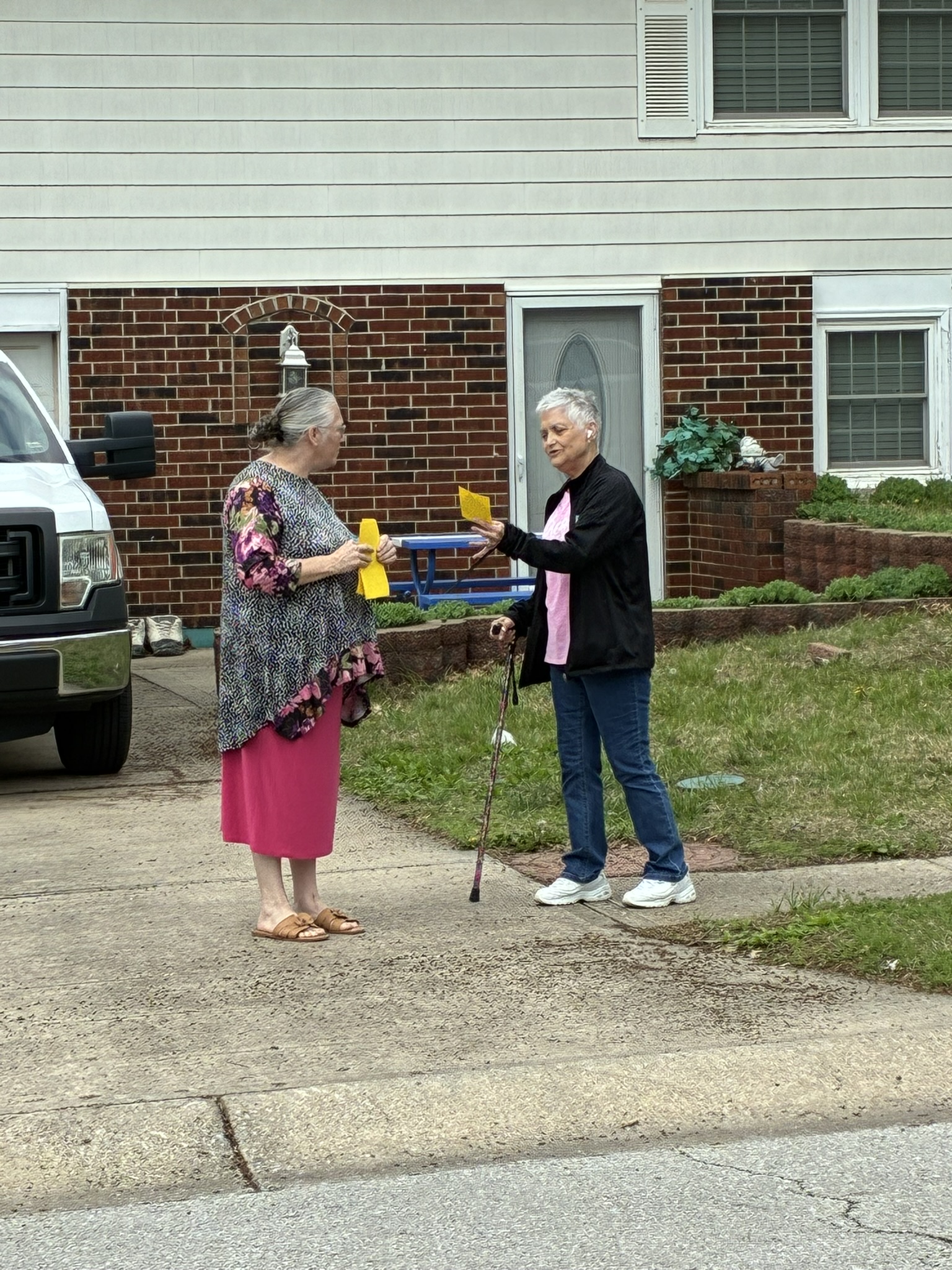 Sis. Coburn sharing the gospel with a neighbor